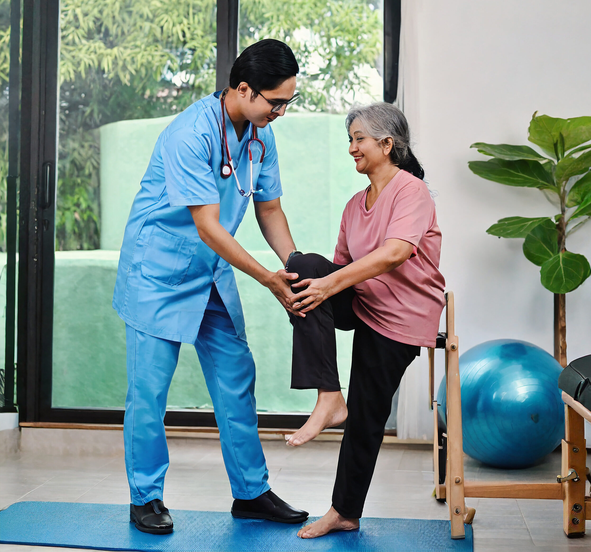 asian female doctor doing physical therapy elderly people with leg pain concept physical reha